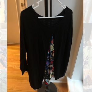 Black Anthropologie sweater with colorful peakaboo